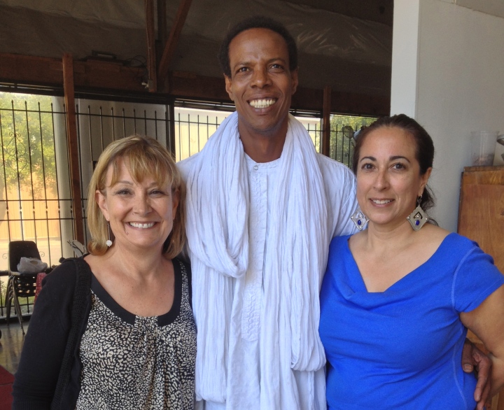 This is Elhadji with me and Sherry. Sherry is wearing some beautiful earrings she bought from Elhadji last year!
